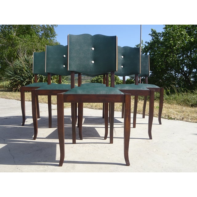 Set of 6 Art Deco period chairs. Original designs in solid wood and studded faux leather. Beech frame in a dark oak...