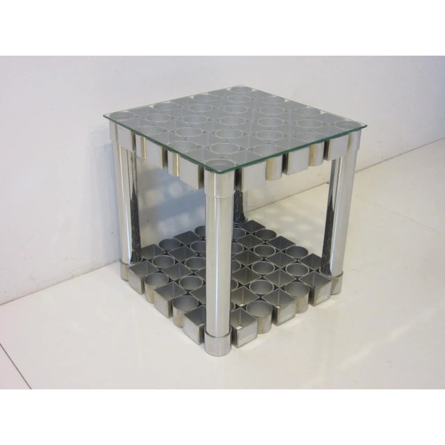A handcrafted 1970's sculptural chromed steel side table with square and circle designs , this Op Art styled piece has all...