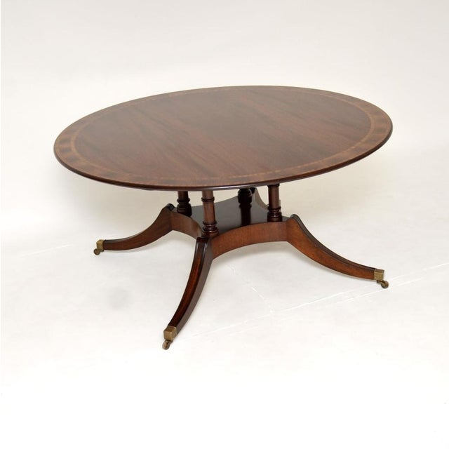 An outstanding large circular antique dining table. This was made in England, it dates from around the 1950’s. It is of...