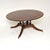 An outstanding large circular antique dining table. This was made in England, it dates from around the 1950’s. It is of...