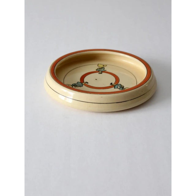 This is an antique Roseville Juvenile creamware plate dating from 1910-1920. Picturing three cute little "Sunbonnet Sues"...