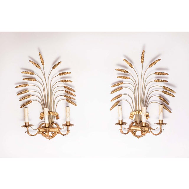 This exquisite pair of 20th-century French sconces captures the timeless elegance and sophistication synonymous with Coco...