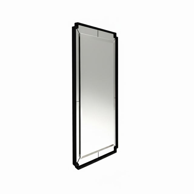 The Davis Mirror features a modern rectangular design with angled mirrored panels and a sleek frame. Its clean lines and...