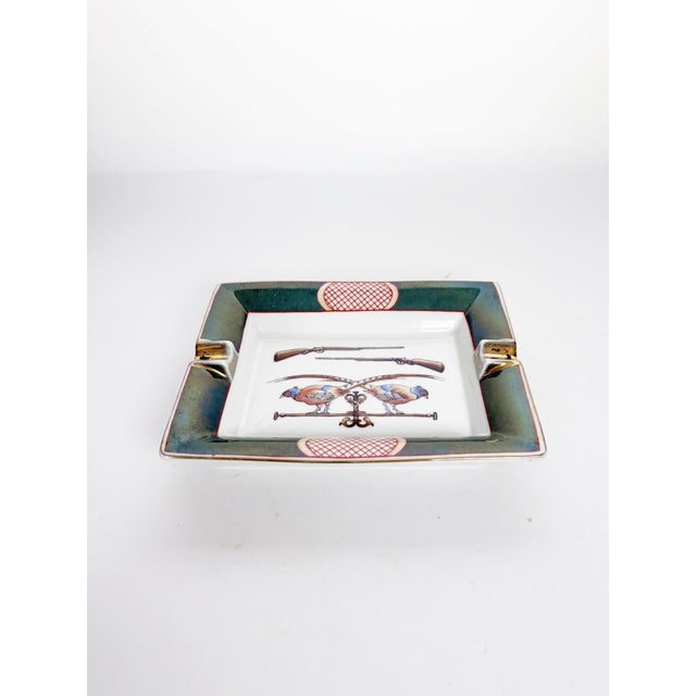 Elegant French ceramic ashtray dating from the 1970s, inspired by the iconic equestrian designs associated with Hermès....