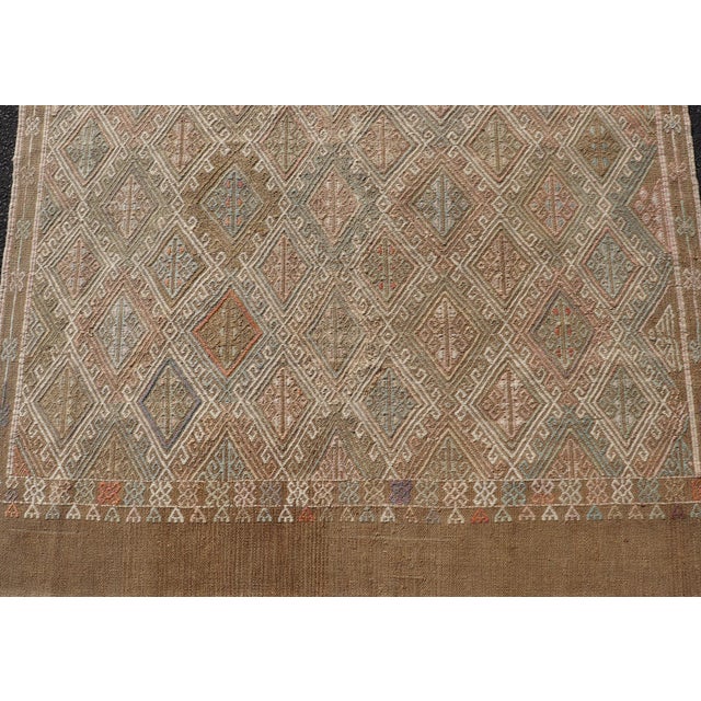 Measures: 4'10" x 6'5" Geometric Diamond Stripe Turkish Vintage Kilim Rug in Warm Earth Tones Keivan Woven Arts / rug...