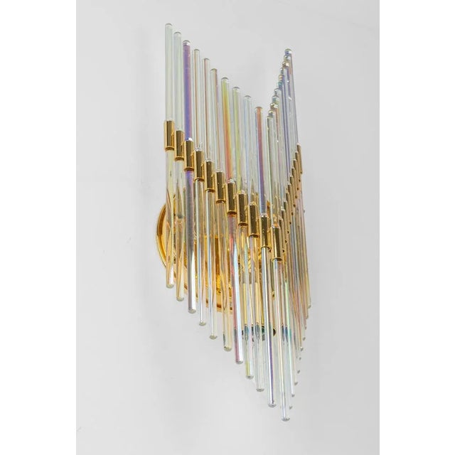 A stunning pair of crystal glass rods wall sconces, germany, 1970s. It’s composed of crystal glass rods on a brass frame....