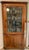 A 19th century Federal corner cupboard cabinet walnut with a warm honey-toned patina, a simple stepped cornice, single...