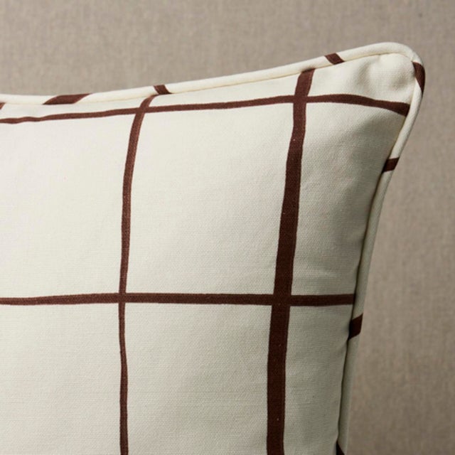 This pillow features Painterly Windowpane by Miles Redd for Schumacher with a self welt finish. Charmingly wonky and drawn...