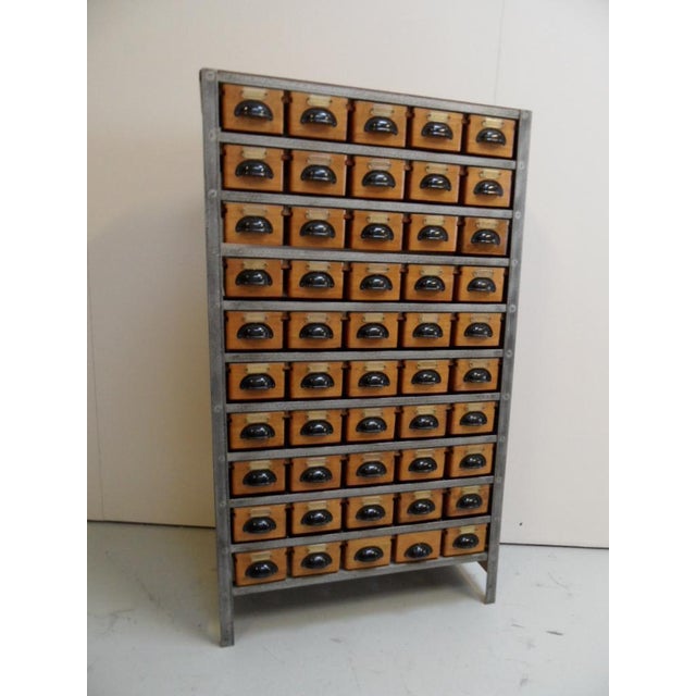 Vintage filing cabinet specially made for a watchmaker with 45 good sliding drawers.