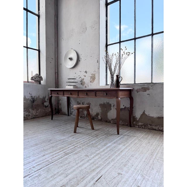 Antique desk or console table in solid oak with some veneer. we love its overall elegance, with its comfortable length and...