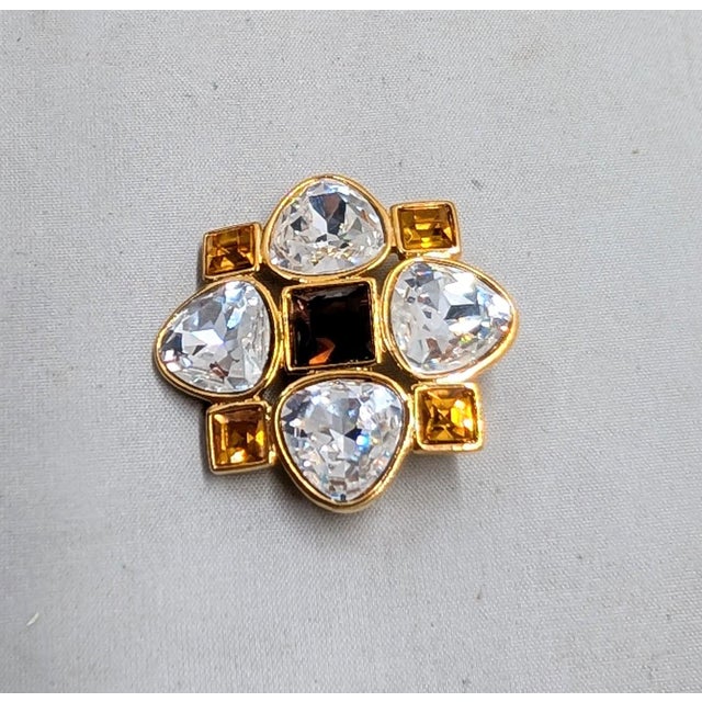 Circa early 1990s goldtone square faux-amethyst center with triangular faux-citrines and oval shaped with one flat side...