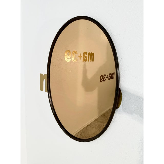 The Vintage Italian Oval Wood Wall Mirror with Smoked Glass from the 1980s is a sleek and sophisticated piece. Its oval...