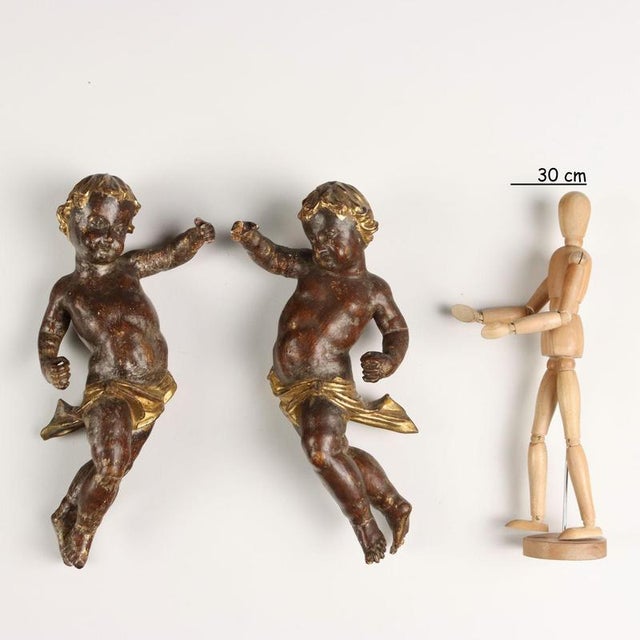 Pair of cherubs in carved, gilded and lacquered wood. This piece is attributed to the mentioned designer/maker. It has no...