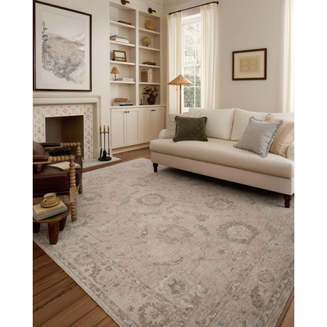 The Louisa Collection is a serene area rug based on beautiful, traditional Turkish designs updated in calm colorways by...