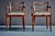 Pair of 1930s French armchairs with serpentine top rails, ladder-back splats and gracefully curved S-shaped armrests on...