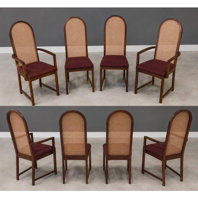 A set of eight mid century modern solid walnut dining chairs with cane rounded backs designed by Milo Baughman for...