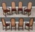 A set of eight mid century modern solid walnut dining chairs with cane rounded backs designed by Milo Baughman for...