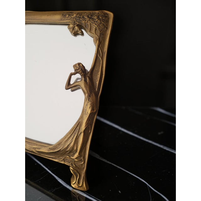 Art Nouveau Table Mirror, Pierre Bex, France, 1970s An elegant table mirror in gilt brass, produced by Pierre Bex—a French...