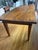 Beautiful 19th-century American primitive harvest table with exceptional character and a richly patinated solid wood plank...