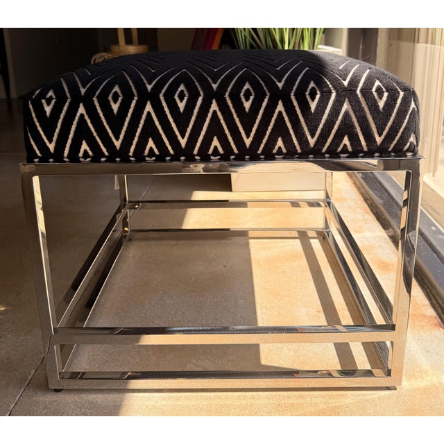 Add a bold touch to your space with this Michael Weiss designed contemporary ottoman featuring a striking black and ivory...