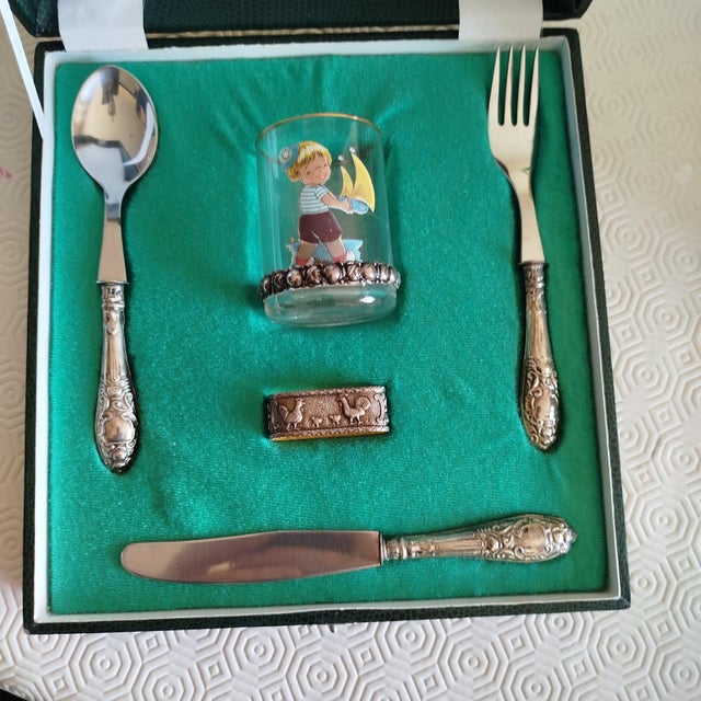 Silver Set of Cutlery (Fork, Knife, Spoon, Napkin Ring and Cup). 161 grams. Height: 8.67 in (22 cm) Width: 8.27 in (21 cm)...