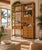 Beautiful pair of vintage coastal étagères crafted from natural rattan and bamboo with woven wicker surfaces. The pair...
