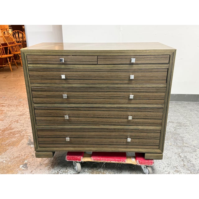 Design Plus Gallery presents a Contemporary Macassar Veneer Six Drawer Dresser. The dresser showcases a linear Macassar-...