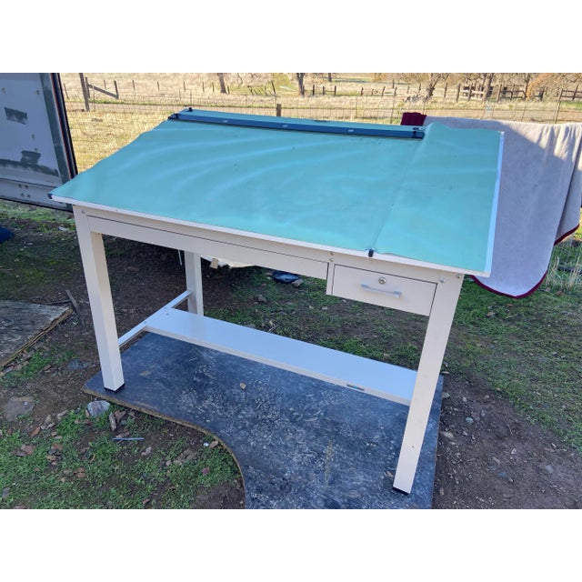 Planhold drafting table with two deep drawers for prints, base is all metal top is laminated and vinyl could be replaced a...
