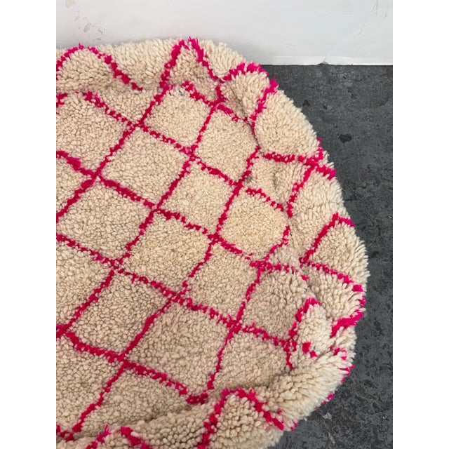 Design Plus Gallery presents a Handmade Pouf from Morocco. The pouf has thick shag hand tufted in off white with diagonal...