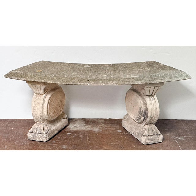 A fine English garden bench or seat of composition stone, featuring a curved top (48 inches length), set upon two plinth...