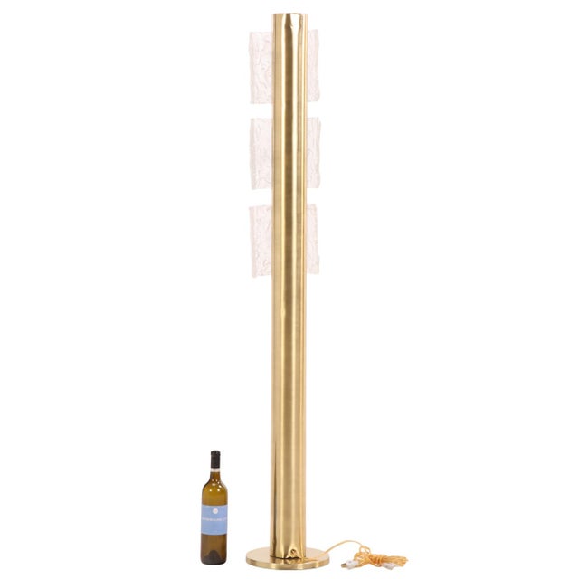 A sophisticated floor lamp designed by Angelo Brotto for Esperia, dating to the 1970s. Executed in brass with Murano glass...