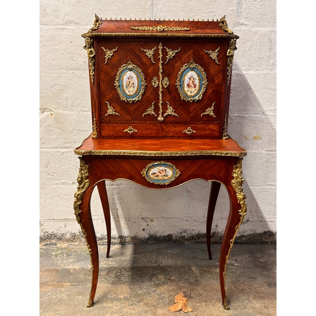 French Louis XVI style inlaid kingwood ladies writing desk with porcelain inserts delicate cabriole legs, adorned with...