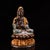 This is a finely cast bronze figurine of Guanyin (the Bodhisattva of Compassion) seated with a child. The deity's face and...