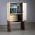 Bar cabinet by Aldo Tura (1909-1963) with goat parchment-covered fronts and straight side panels as a base. The bar...