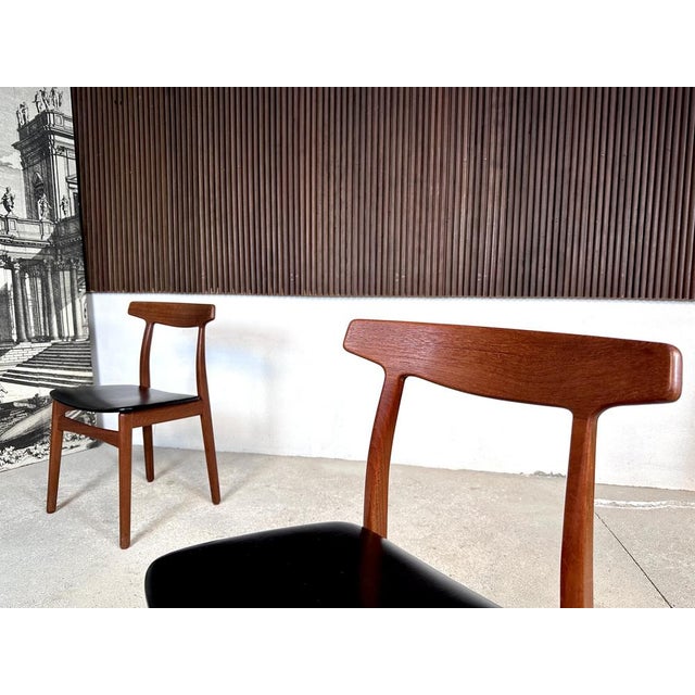 This set of high-quality modernist side or dining chairs was designed by Henning Kjaernulf for Bruno Hansen in Denmark...