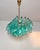 Elegant italian chandelier made from 56 beautiful murano turquoise glasses "poliedri". Structure in gold and brass colored...