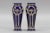 An adorable pair of small Art Nouveau period vases. These beautiful vases are made of glazed ceramic in indigo blue color...