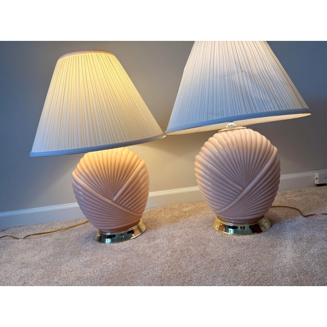 Elevate your space with this exquisite pair of postmodern 1980s table lamps, featuring a sculptural seashell motif....