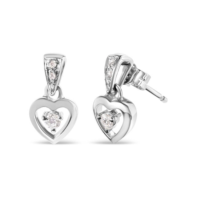 You will fall in love with these beautiful dangle heart stud earrings. Fashioned in 14k white gold, they feature 1/6 ct...