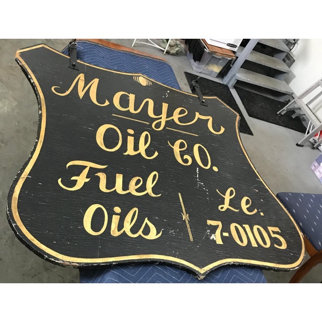 Large painted black with gold leaf letters sign, advertising Mayer Oil Co.. There are 26.75 inches between the iron...