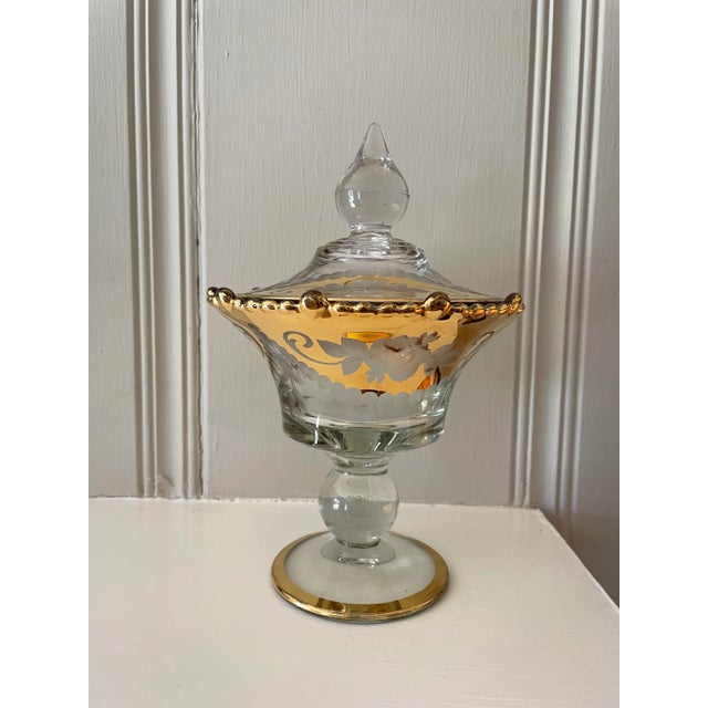 This is an elegant and beautiful glass, etched lidded compote with lots of gold trim. The gold back ground is etched...