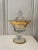 This is an elegant and beautiful glass, etched lidded compote with lots of gold trim. The gold back ground is etched...