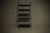 Shelving unit from the 1990s. The piece has two steel uprights and distinctive perforated steel shelves. The design...