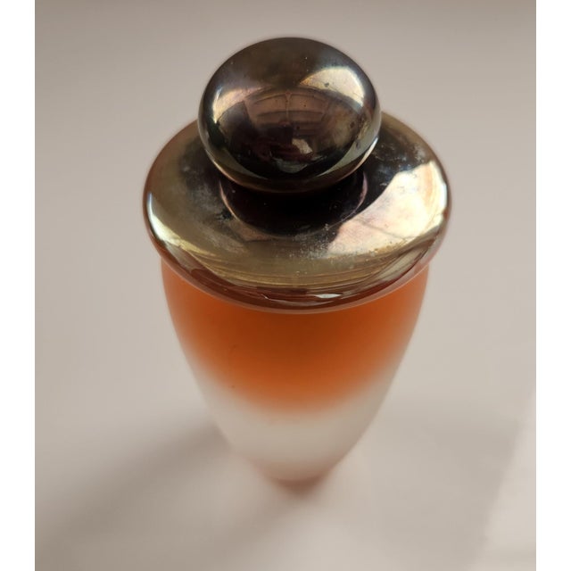 Decorative glass perfume bottle with frosted glass. the top is