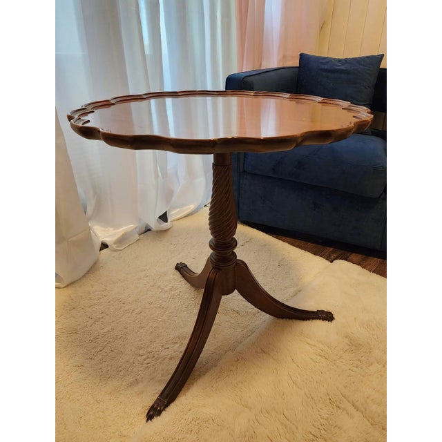 Chippendale mahogany scalloped edge petite tea table with paw feet from Brandt, circa 1940s.