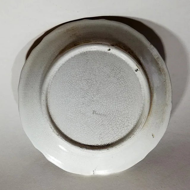 Ceramic plates from Bassano decorated with polychrome flowers on a white background. This piece has an attribution mark, I...