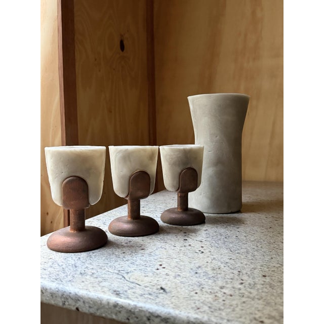 A rare and enigmatic find for collectors of mid-century avant-garde design, this exceptional 4-piece studio barware set...