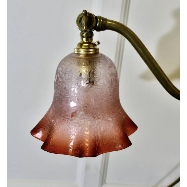 French Brass Desk/Table Lamp with Detailed Pink/Amber Glass Shade This is a very attractive piece, the lamp has a central...