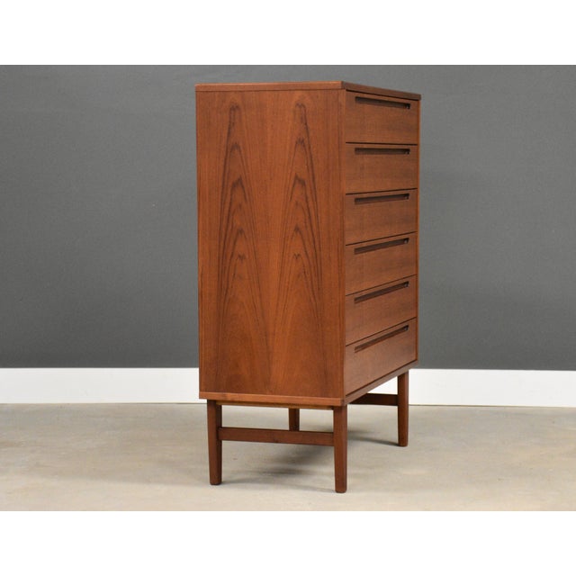 A mid century modern teak tall dresser with inset pulls by Tørring Møbelfabrik. Made in Denmark. Professionally...