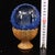This is a rare and unusual Buddhist relic sphere, described as a "regenerated sarira" containing an etched image of a...